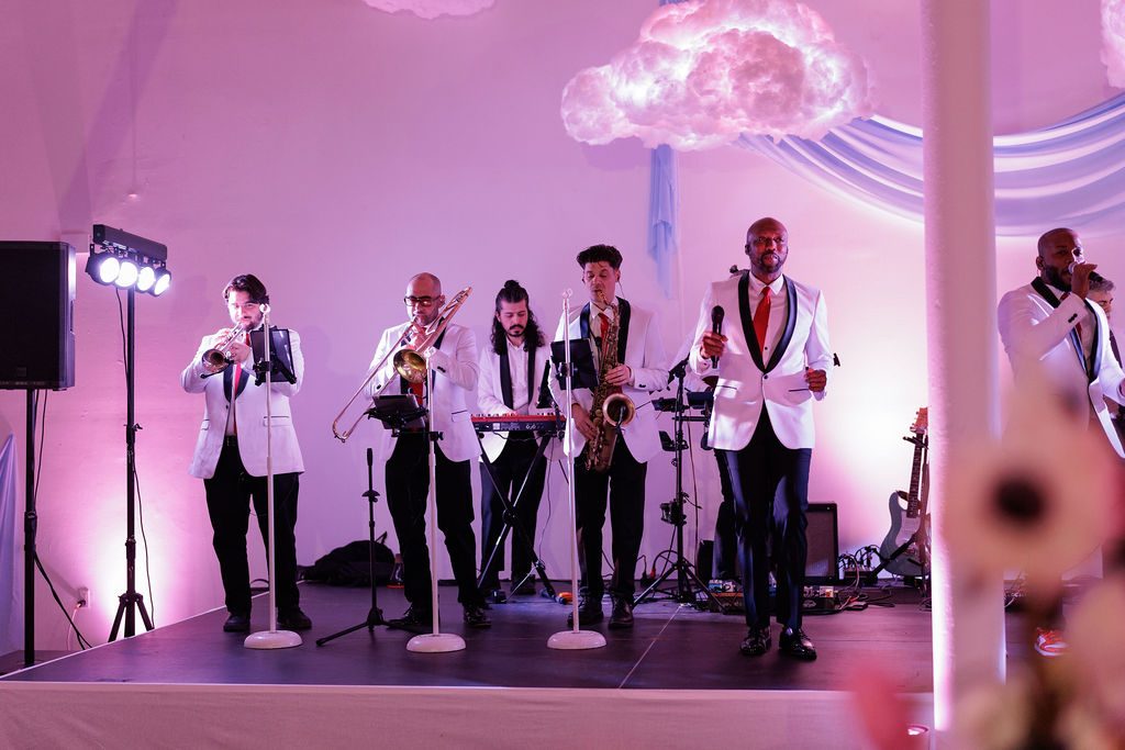 Live band performing under coloured lighting at a corporate holiday celebration in New York City